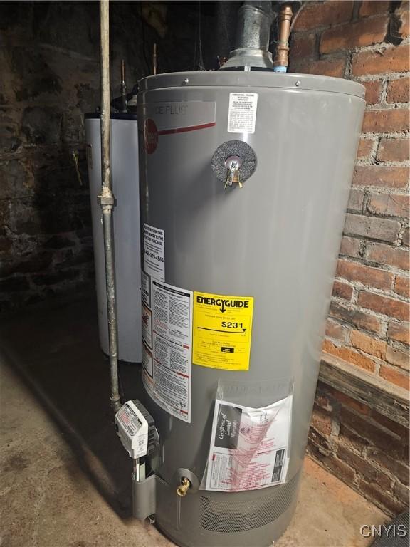 utility room featuring water heater