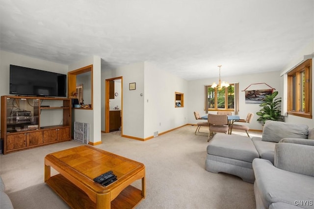 carpeted living room with an inviting chandelier