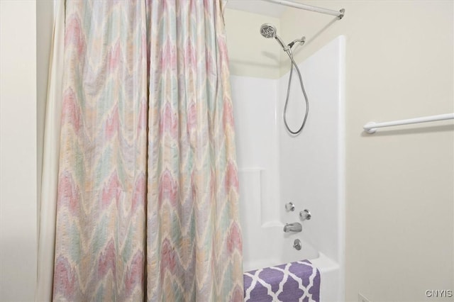 bathroom featuring shower / bath combination with curtain