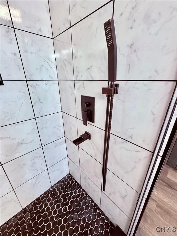 room details with a tile shower