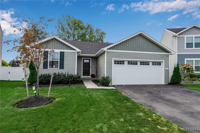 view of front facade with a garage and a front lawn