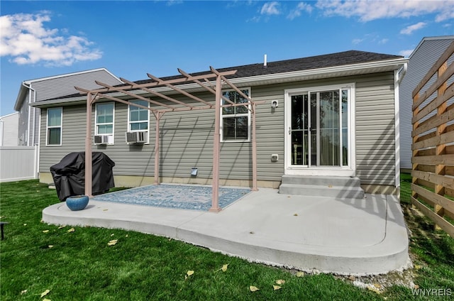 back of property with cooling unit, a yard, a pergola, and a patio area