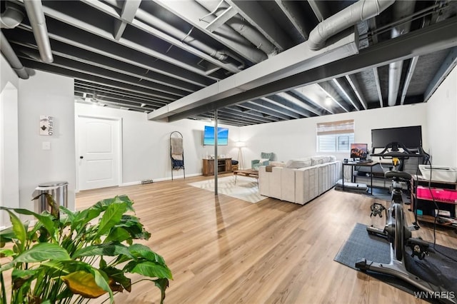 exercise area featuring hardwood / wood-style floors