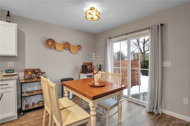 dining space featuring light hardwood / wood-style floors