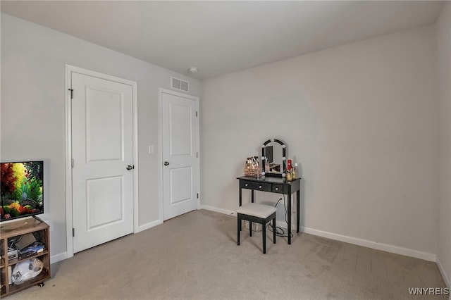 miscellaneous room with light colored carpet