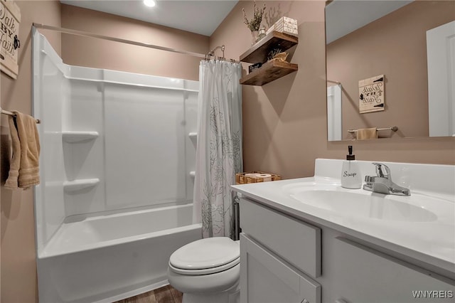 full bathroom with vanity, shower / tub combo with curtain, and toilet