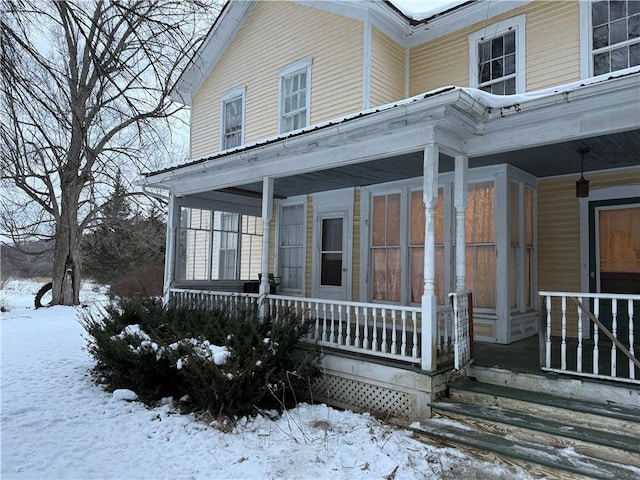 view of snow covered property entrance