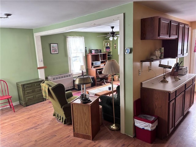 office area with ceiling fan and light wood-type flooring