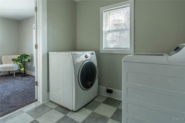 washroom featuring independent washer and dryer and light colored carpet