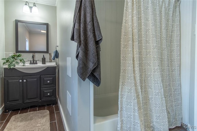 bathroom featuring vanity, ornamental molding, and shower / tub combo with curtain