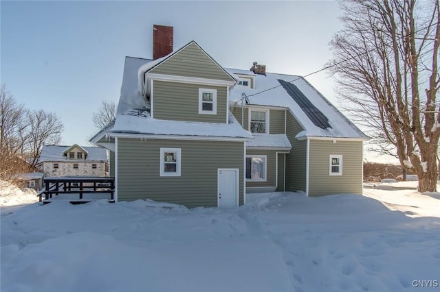 view of snow covered house