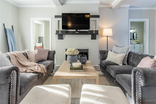 living room featuring ornamental molding and a brick fireplace