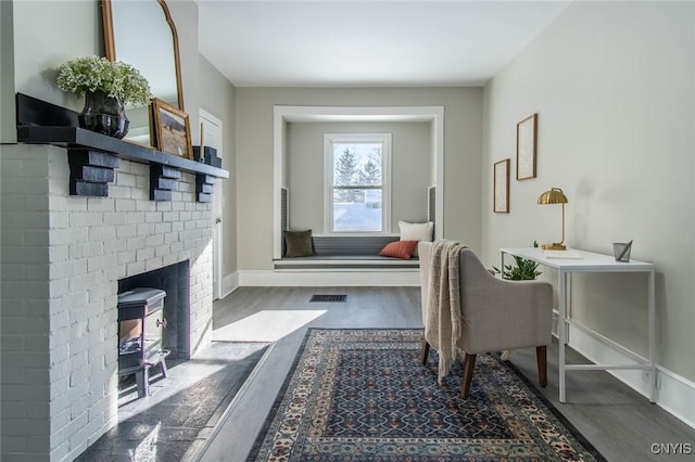 home office with dark wood-type flooring