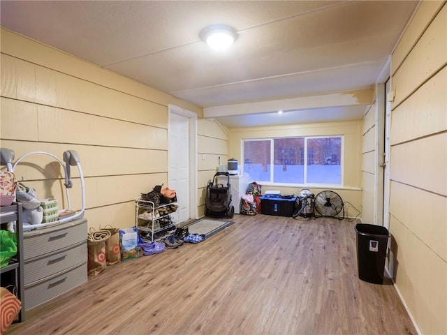 miscellaneous room featuring hardwood / wood-style floors and beam ceiling