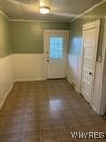 interior space with crown molding