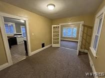 unfurnished bedroom featuring dark carpet