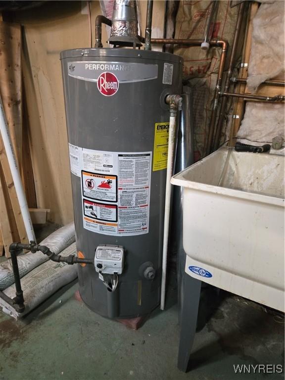 utility room featuring water heater