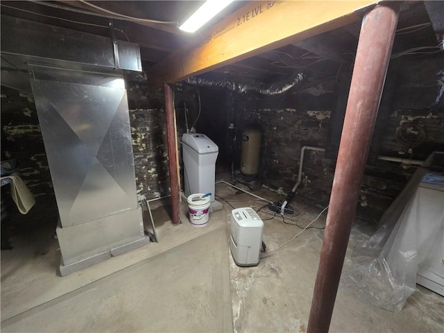 basement featuring heating unit