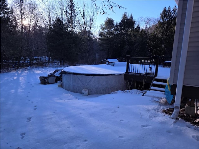 view of yard layered in snow