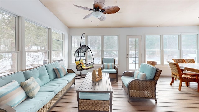 sunroom with lofted ceiling and ceiling fan