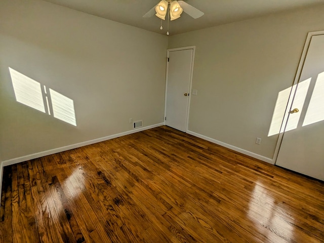 unfurnished room with hardwood / wood-style flooring and ceiling fan