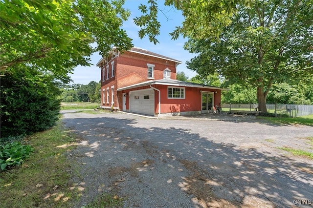 view of side of home with a garage