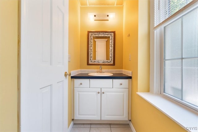 bathroom featuring tile patterned flooring and vanity