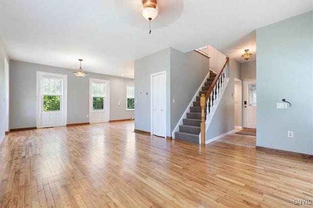 unfurnished living room with light wood-type flooring