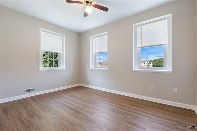 unfurnished room featuring hardwood / wood-style flooring and ceiling fan