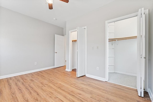 unfurnished bedroom with light hardwood / wood-style flooring and ceiling fan