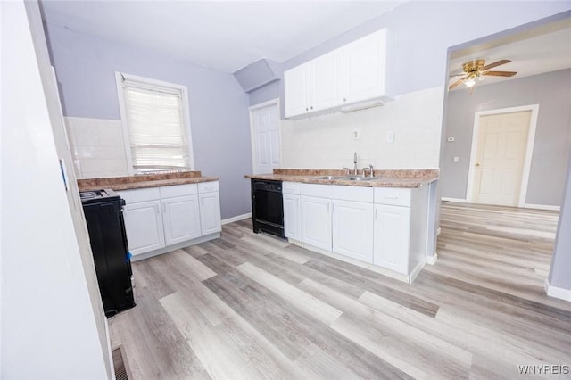 kitchen featuring light wood-type flooring, black appliances, sink, and white cabinets