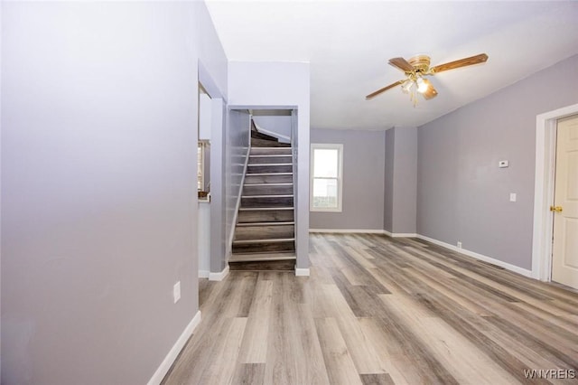 interior space featuring light hardwood / wood-style floors and ceiling fan