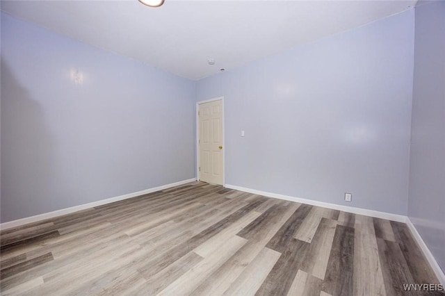 unfurnished room featuring wood-type flooring