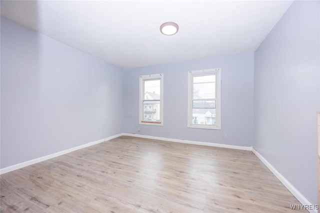 spare room featuring light hardwood / wood-style flooring