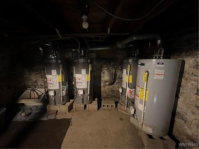 utility room featuring gas water heater