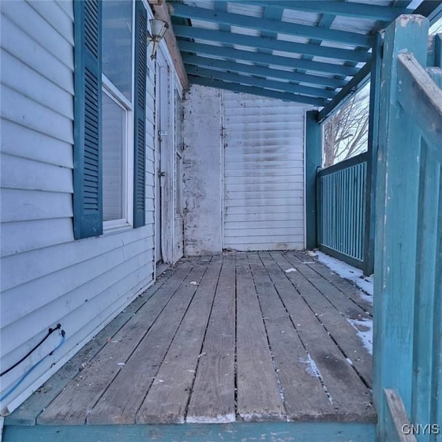 exterior space featuring hardwood / wood-style flooring and lofted ceiling