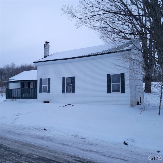 view of snow covered house