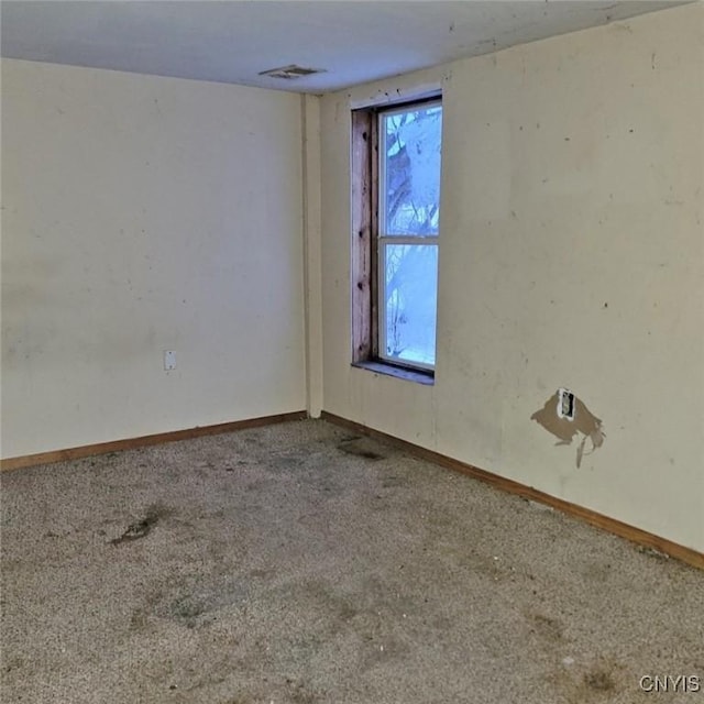 unfurnished room featuring carpet flooring