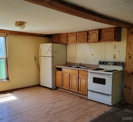207 S Rd, Plainfield, NY 13491 - kitchen with white appliances, brown cabinetry, a sink, light wood finished floors, and beamed ceiling