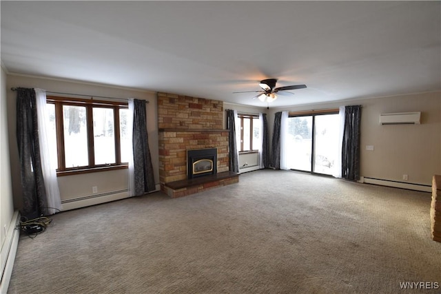 unfurnished living room with a baseboard heating unit, a wealth of natural light, carpet floors, and a wall unit AC