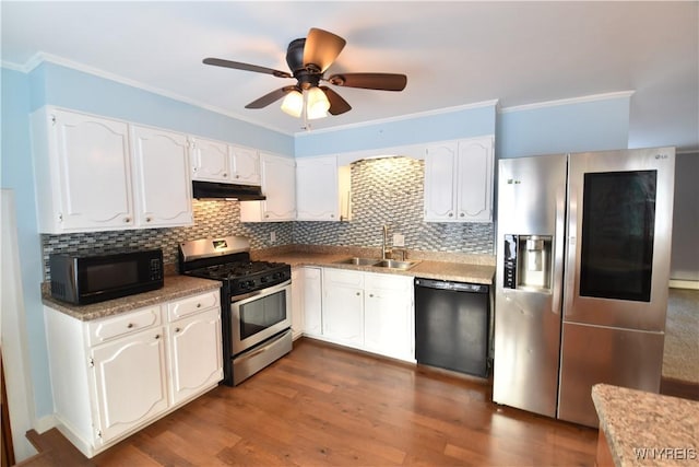 kitchen with sink, white cabinets, ornamental molding, black appliances, and dark wood-type flooring