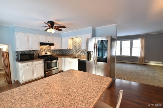 kitchen featuring tasteful backsplash, white cabinetry, ornamental molding, and black appliances