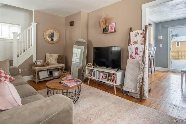 living room featuring plenty of natural light and hardwood / wood-style floors