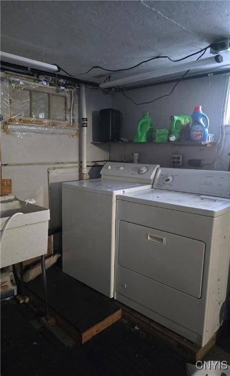 laundry room featuring separate washer and dryer and sink