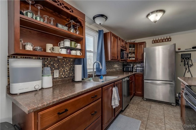 kitchen with light tile patterned flooring, sink, tasteful backsplash, crown molding, and appliances with stainless steel finishes