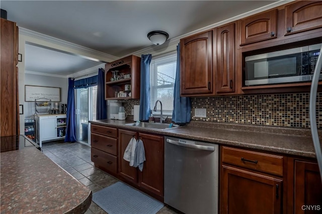 kitchen featuring crown molding, sink, decorative backsplash, and appliances with stainless steel finishes