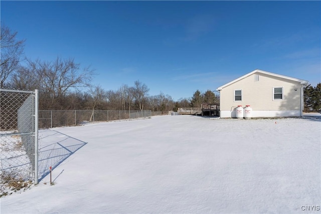 view of yard layered in snow