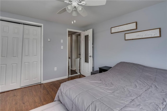 bedroom featuring hardwood / wood-style flooring, ceiling fan, and a closet