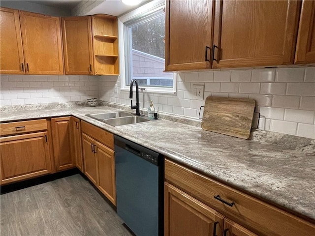 kitchen featuring stainless steel dishwasher, dark hardwood / wood-style floors, sink, and backsplash