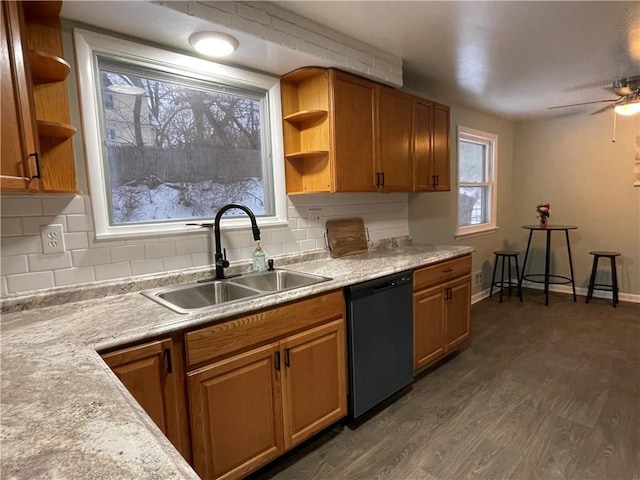 kitchen with sink, dishwasher, ceiling fan, backsplash, and dark hardwood / wood-style flooring